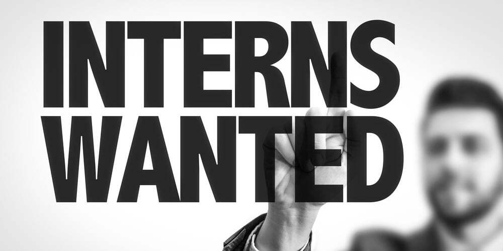 Business man pointing the text Interns Wanted-517181-edited.jpeg